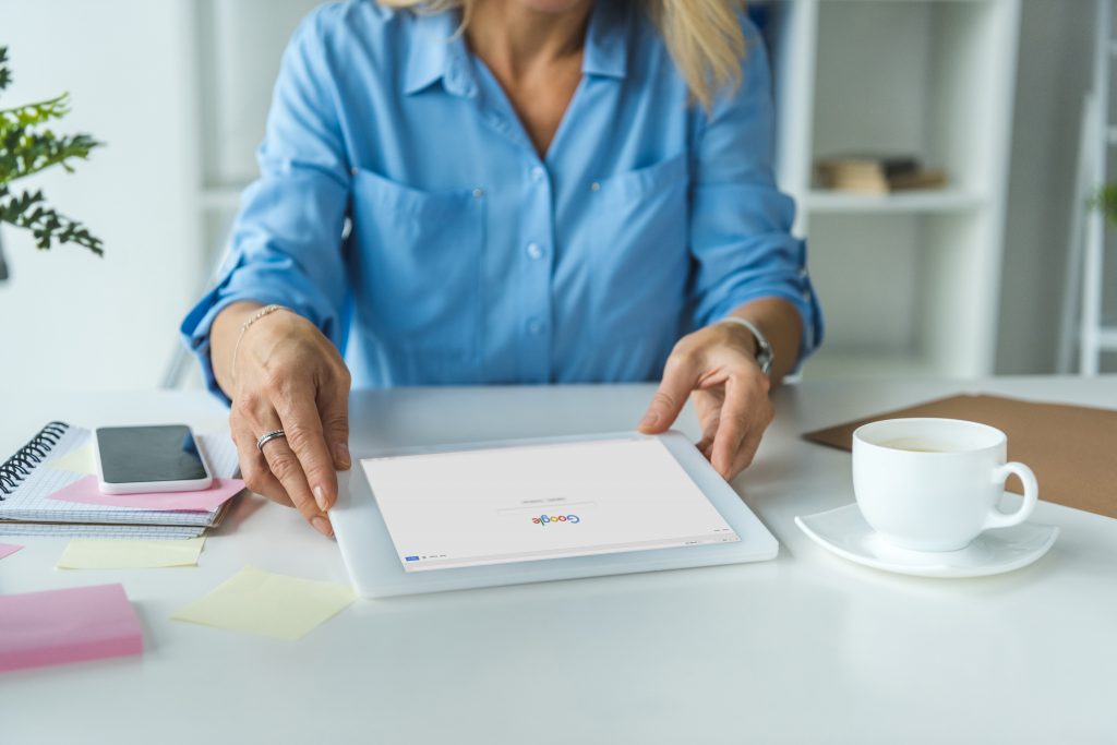 businesswoman using tablet with Google