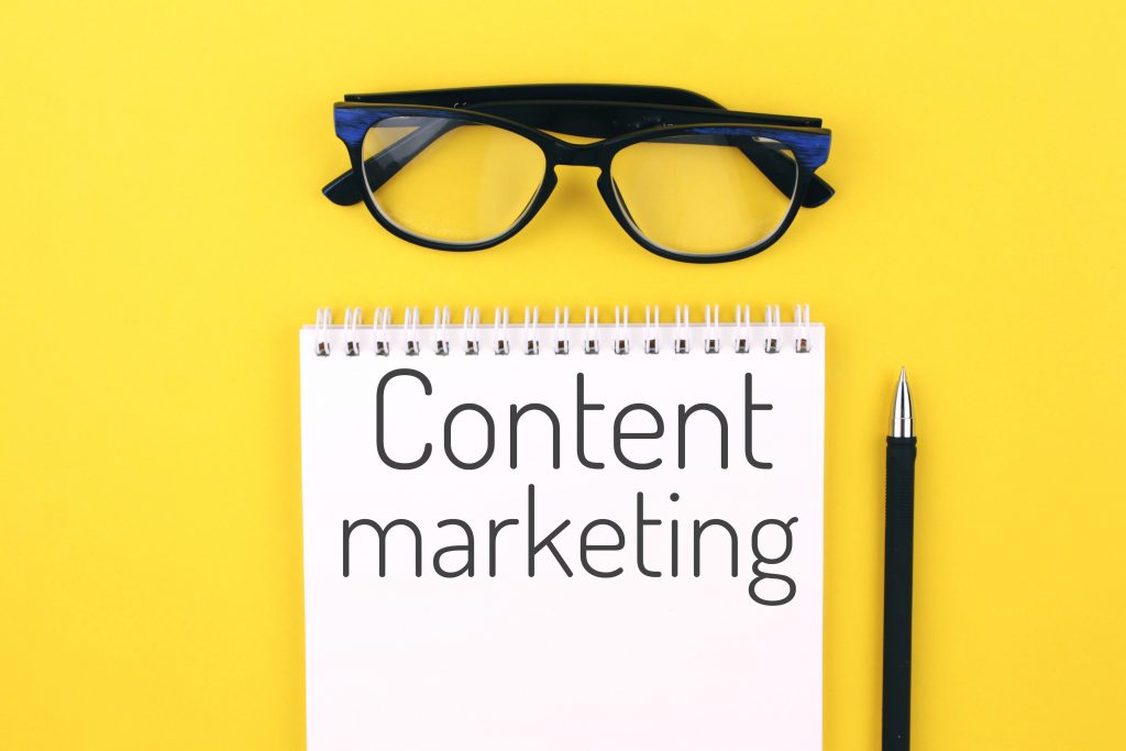 notebook with word content marketing